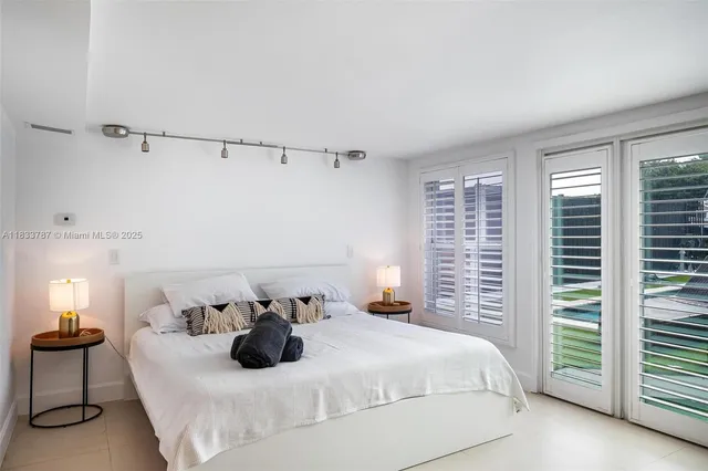 a lobby with furniture and a potted plant