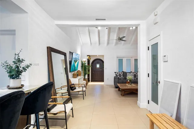 a view of a dining room with furniture wooden floor and chandelier