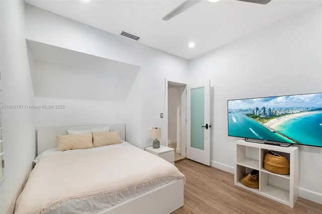 an aerial view of residential houses with outdoor space and swimming pool