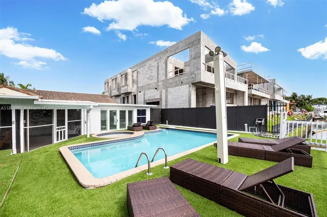 an aerial view of residential building and lake