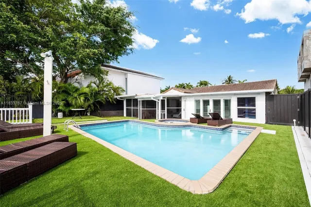 an aerial view of residential building and lake