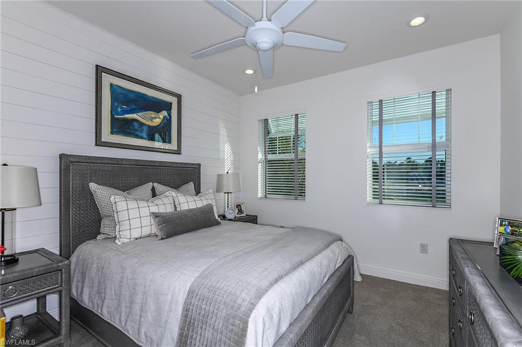 2621 Seychelles Circle, Unit 1806 Naples, FL 34112 - Photo 16 of 25 a bedroom with bed and window
