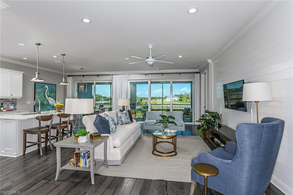 2621 Seychelles Circle, Unit 1806 Naples, FL 34112 - Photo 3 of 25 a living room with furniture and a wooden floor