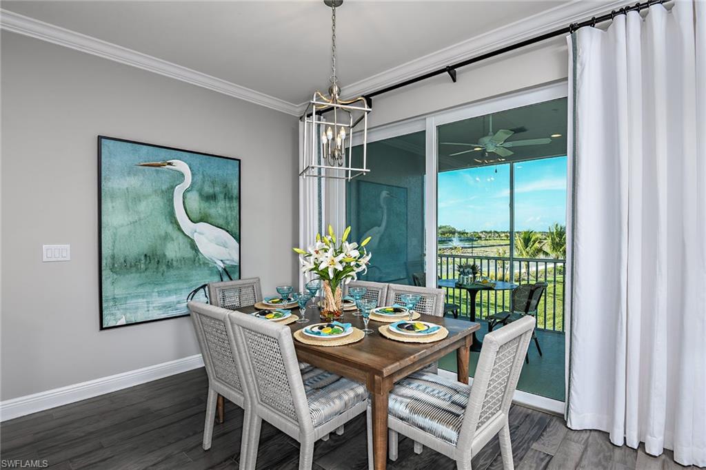 2621 Seychelles Circle, Unit 1806 Naples, FL 34112 - Photo 6 of 25 a dining room with furniture potted plants and wooden floor