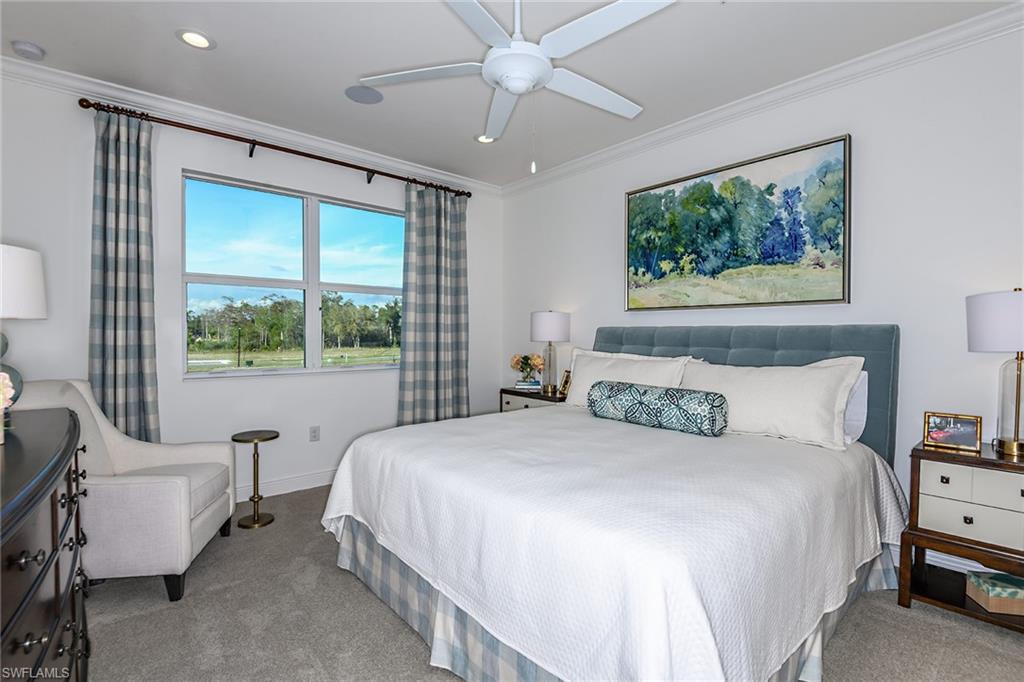 2621 Seychelles Circle, Unit 1806 Naples, FL 34112 - Photo 10 of 25 a bedroom with a large bed and a window