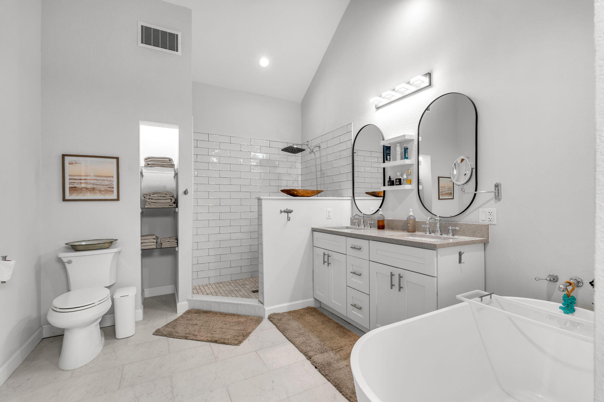 24 Mutiny Place Key Largo, FL 33037 - Photo 28 of 69 a spacious bathroom with a toilet a sink and a mirror