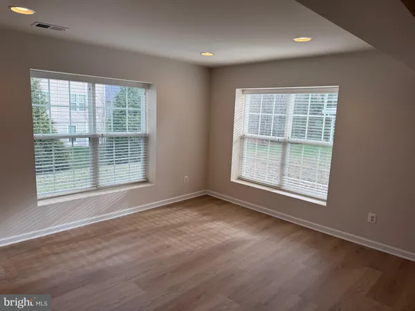 a view of a livingroom with a refrigerator