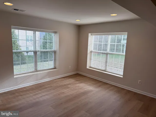 a view of a livingroom with a refrigerator