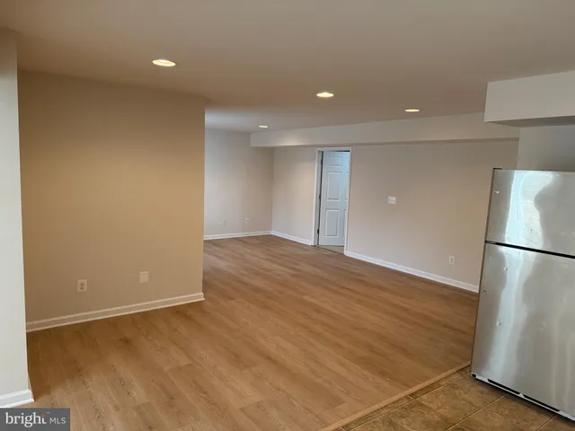 a kitchen with a sink and a refrigerator