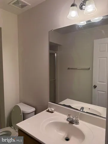 a bathroom with a shower and a toilet