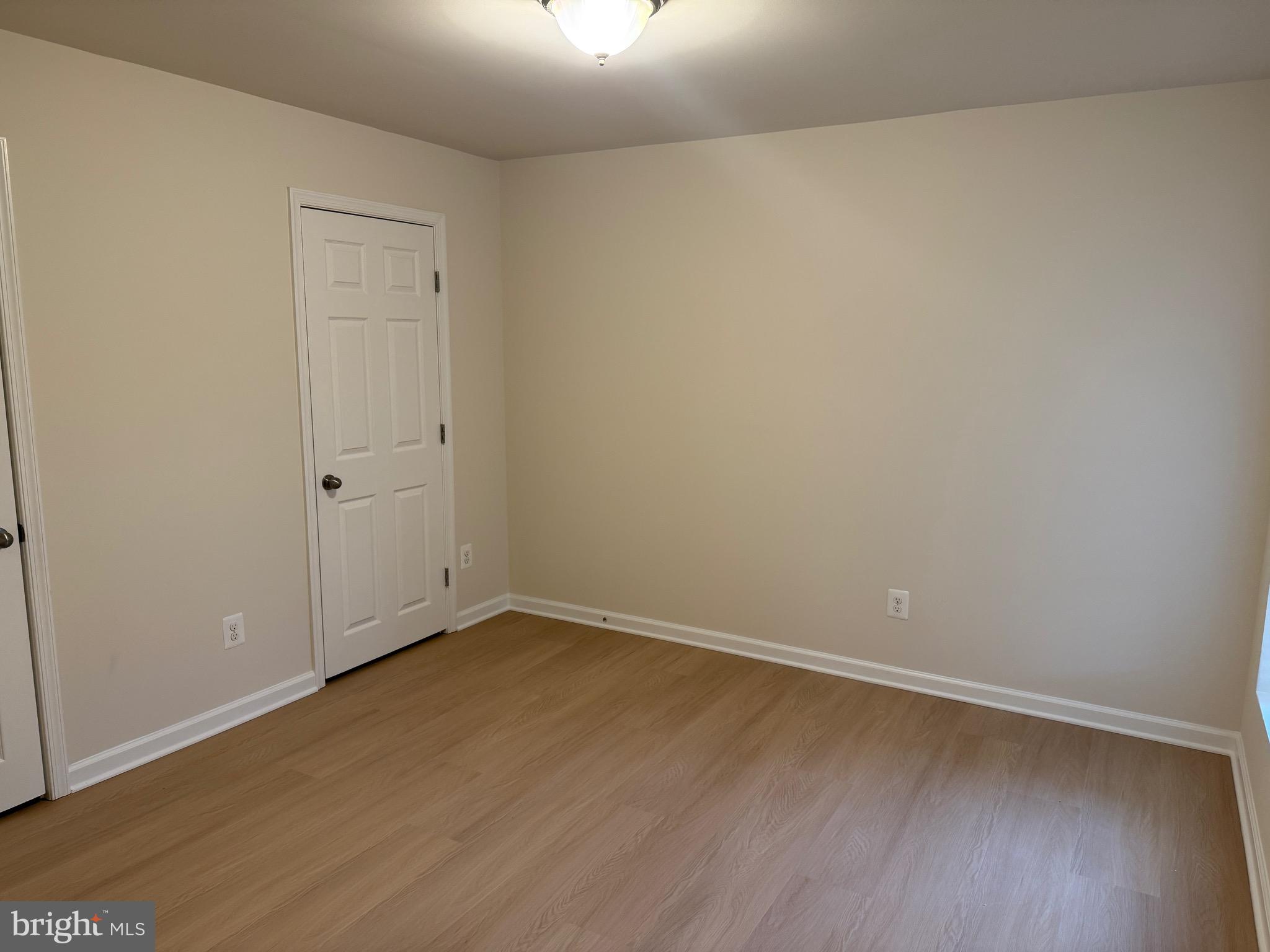 6231 Glen Wood Loop Manassas, VA 20112 - Photo 6 of 18 a view of an empty room with wooden floor