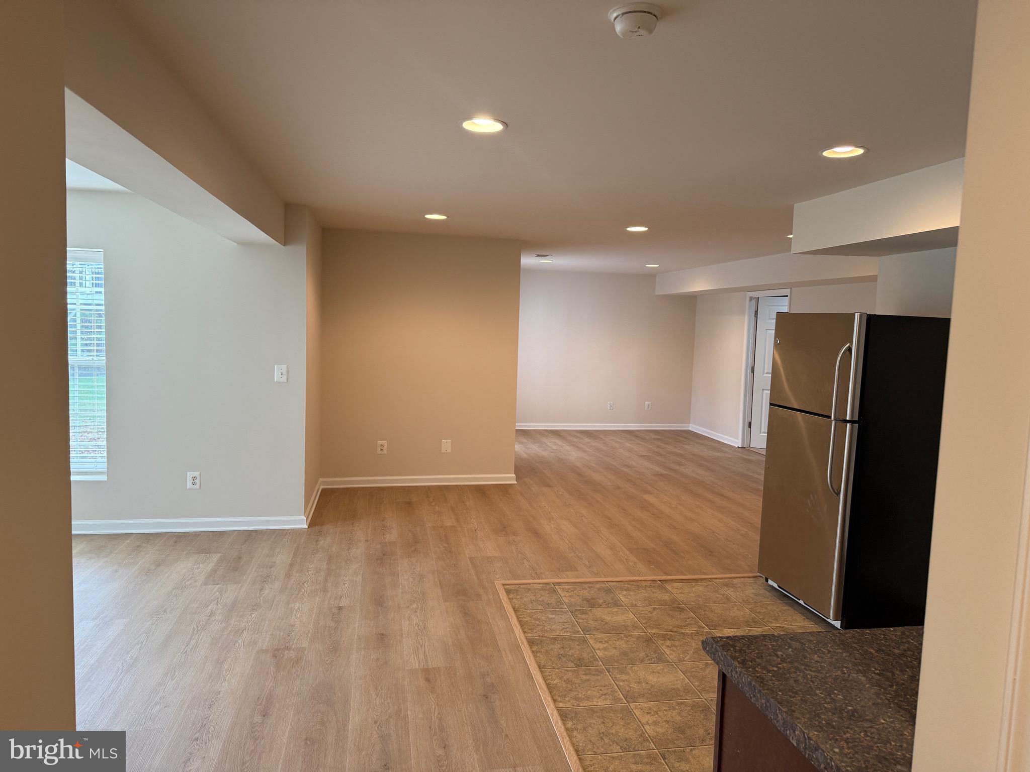 6231 Glen Wood Loop Manassas, VA 20112 - Photo 8 of 18 a view of a livingroom with a refrigerator