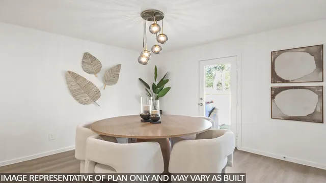 a dining room with wooden floor a chandelier