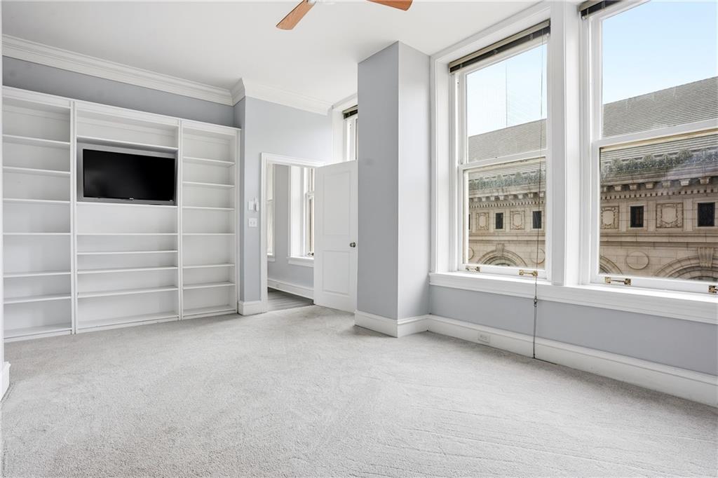 57 Forsyth Street Northwest, Unit 5D Atlanta, GA 30303 - Photo 14 of 28 a view of an empty room with a fireplace and a window
