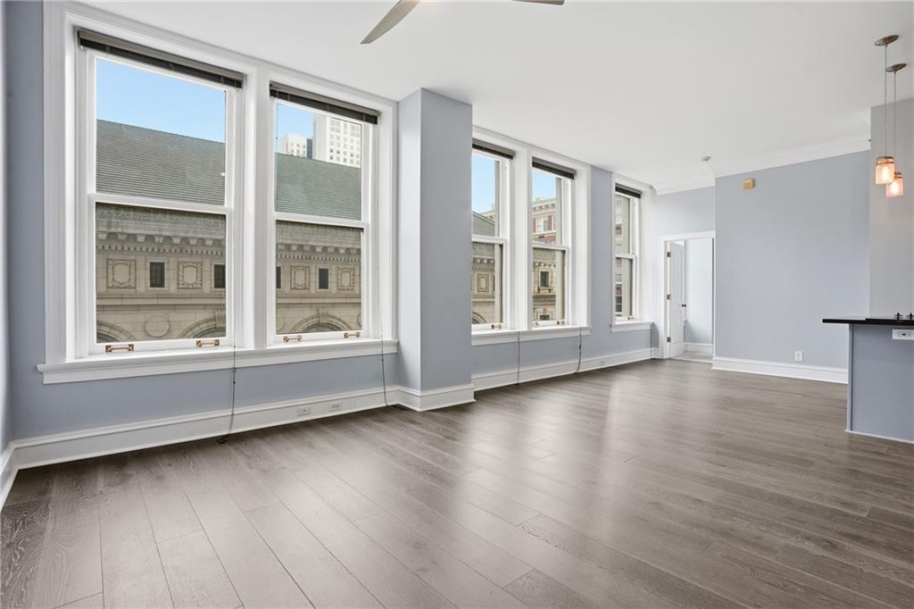 57 Forsyth Street Northwest, Unit 5D Atlanta, GA 30303 - Photo 25 of 28 a view of an empty room with wooden floor and a window