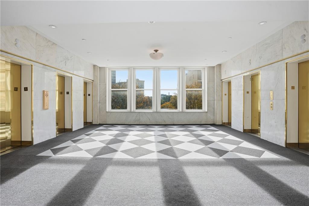 57 Forsyth Street Northwest, Unit 5D Atlanta, GA 30303 - Photo 3 of 28 a view of an empty room with window and a kitchen