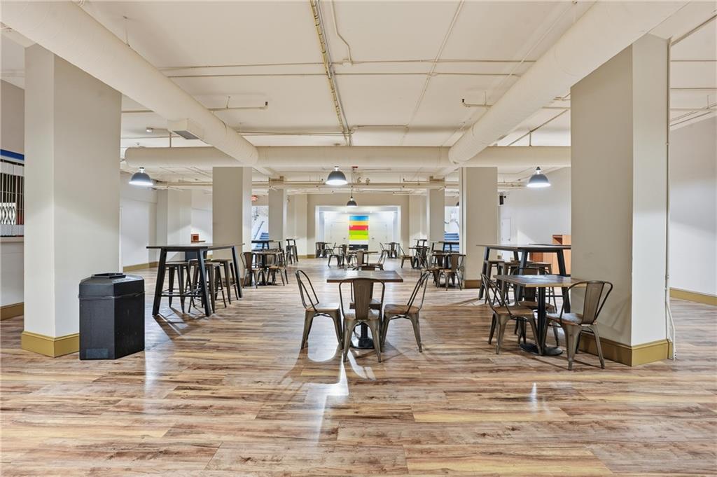 57 Forsyth Street Northwest, Unit 5D Atlanta, GA 30303 - Photo 5 of 28 a view of a dining hall with lots of dining table and chairs