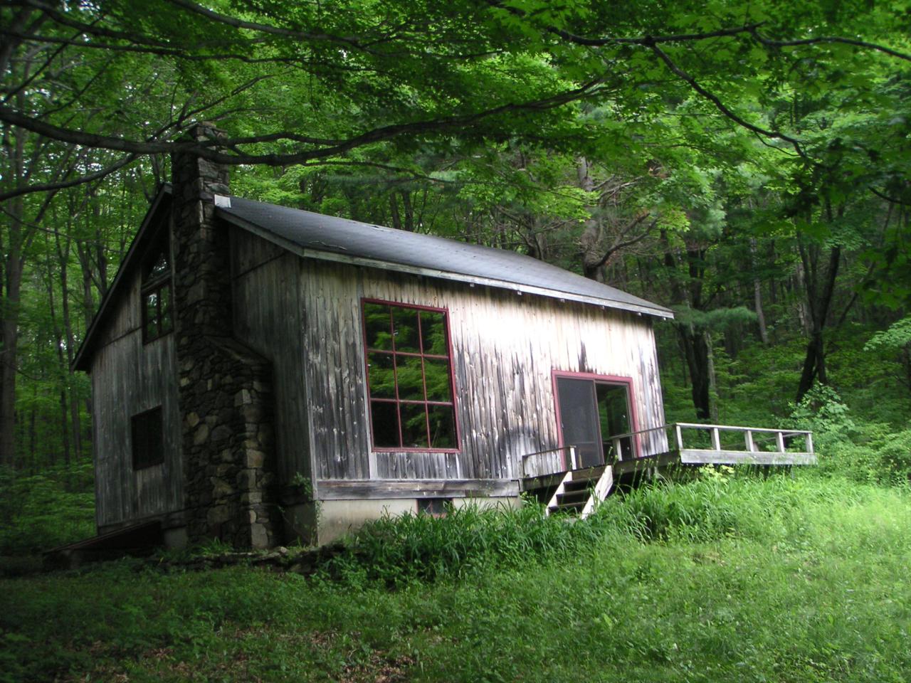 88 Webster Road Tyringham, MA 01264 - Photo 1 of 10 a view of a chair and table in backyard of the house