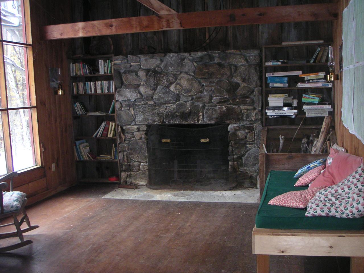 88 Webster Road Tyringham, MA 01264 - Photo 3 of 10 a living room with furniture a flat screen tv and a fireplace