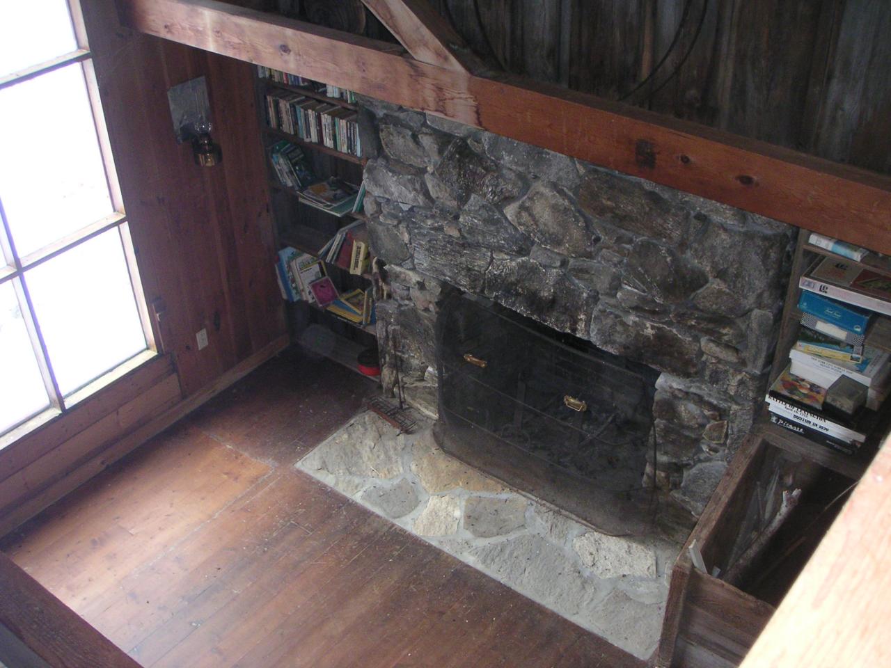 88 Webster Road Tyringham, MA 01264 - Photo 4 of 10 a view of an empty room with wooden floor and a window