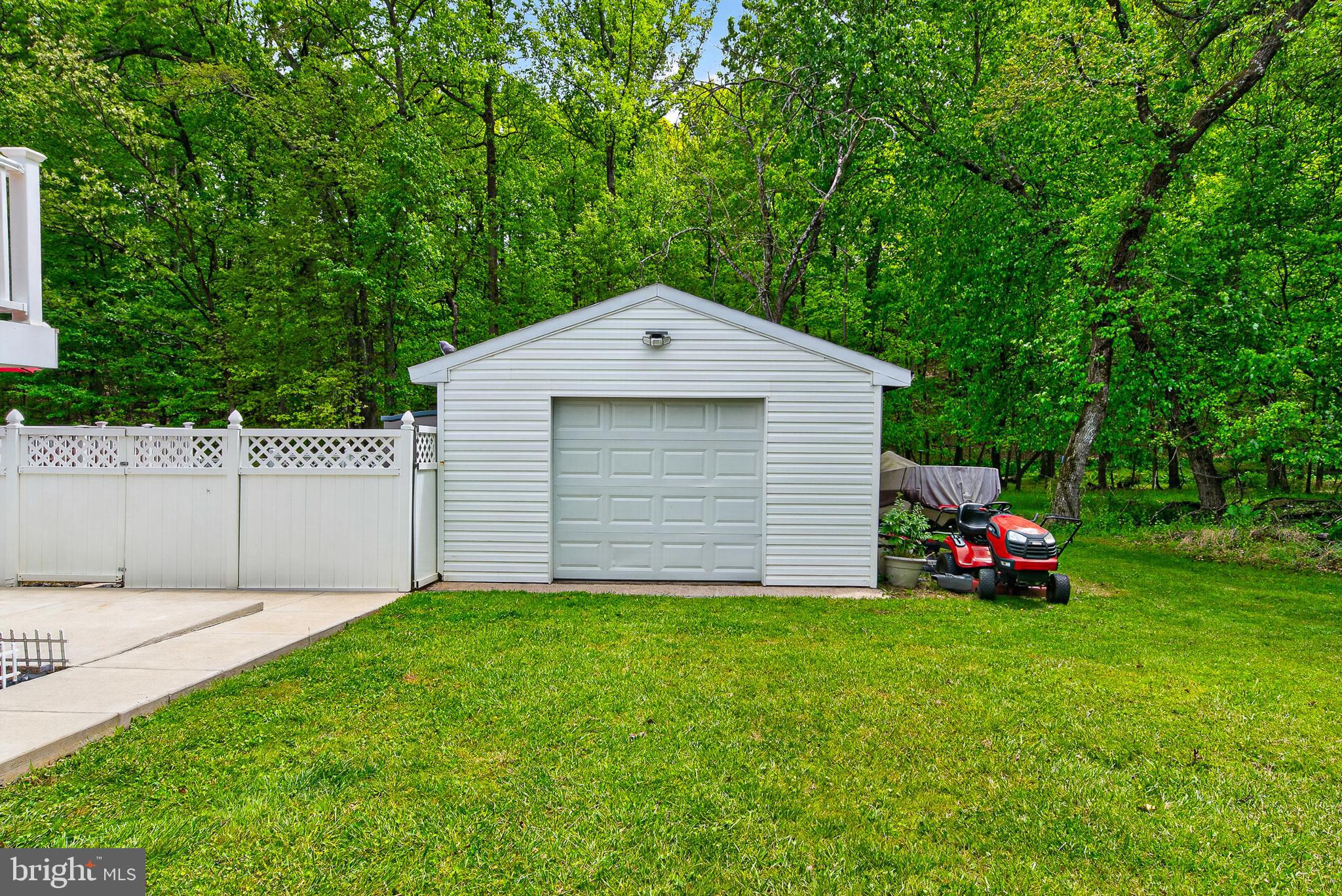 4603 Lathe Road Owings Mills, MD 21117 - Photo 45 of 86 a front view of a house with a garden and yard
