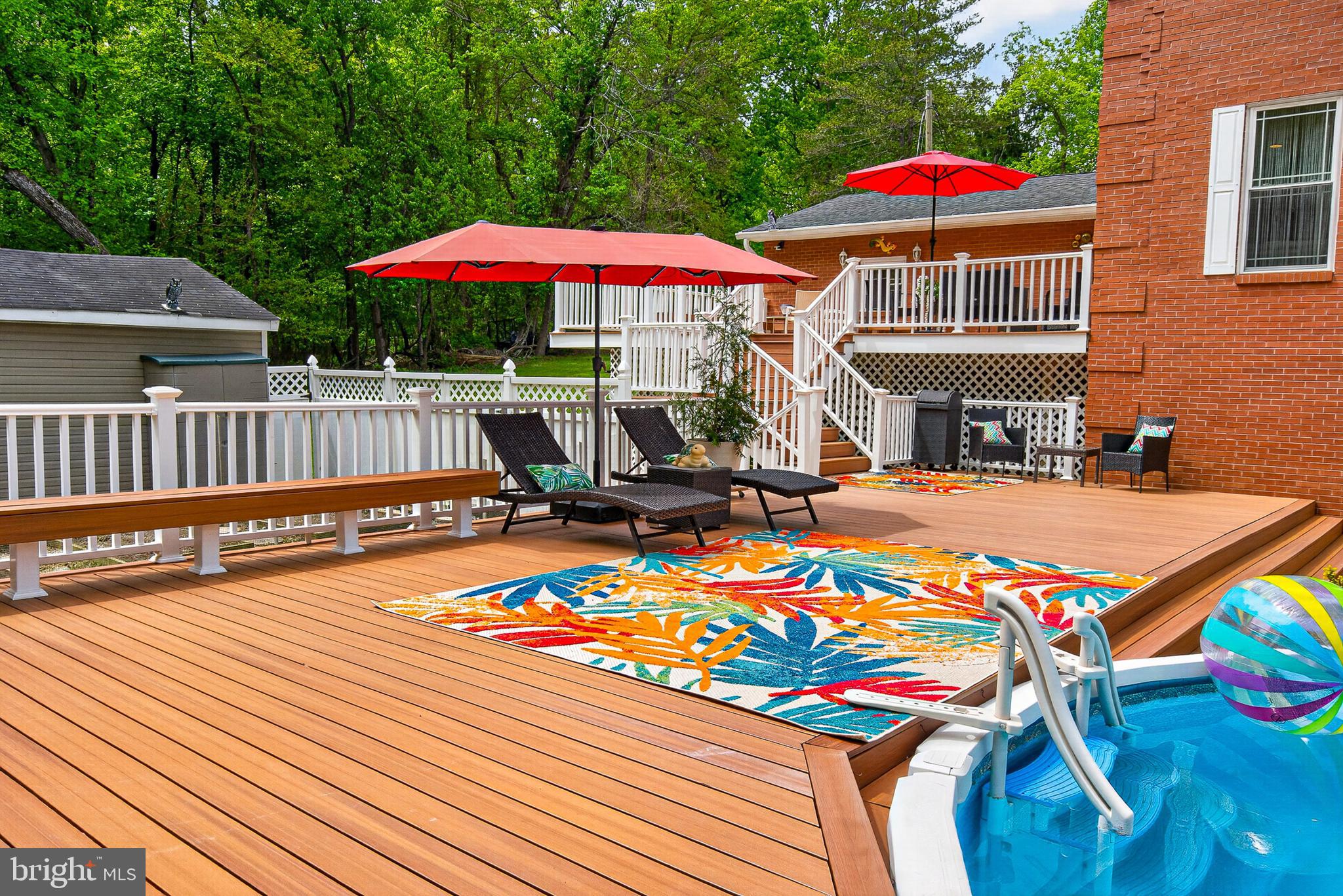 4603 Lathe Road Owings Mills, MD 21117 - Photo 67 of 86 a view of a patio with a table and chairs under an umbrella