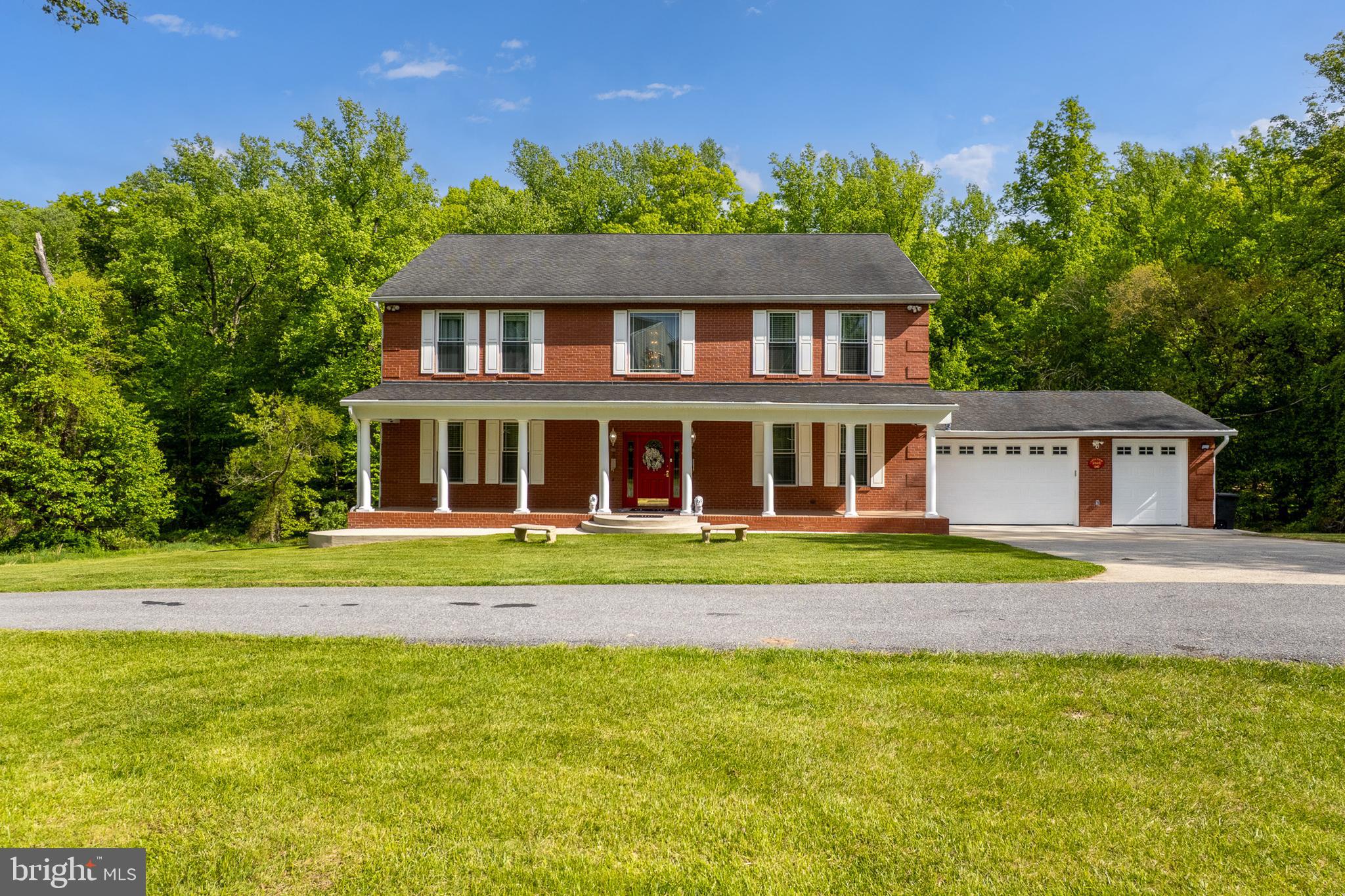 4603 Lathe Road Owings Mills, MD 21117 - Photo 81 of 86 a front view of a house with a yard
