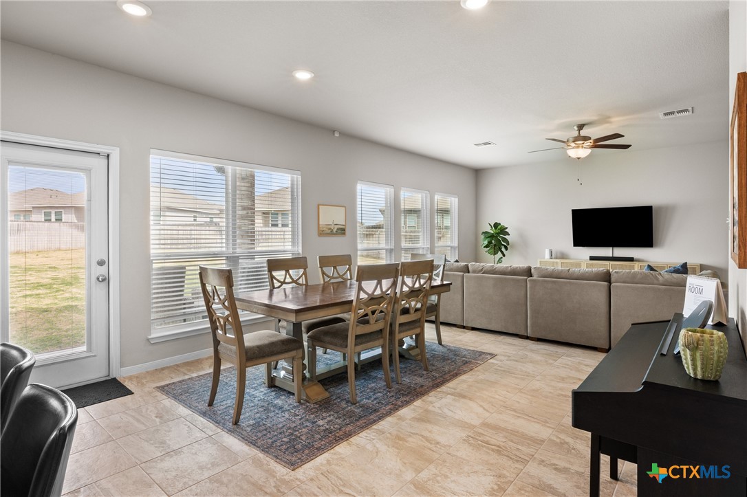 7468 Mossy Ridge Lane Temple, TX 76502 - Photo 12 of 38 a view of a dining room with furniture and a window