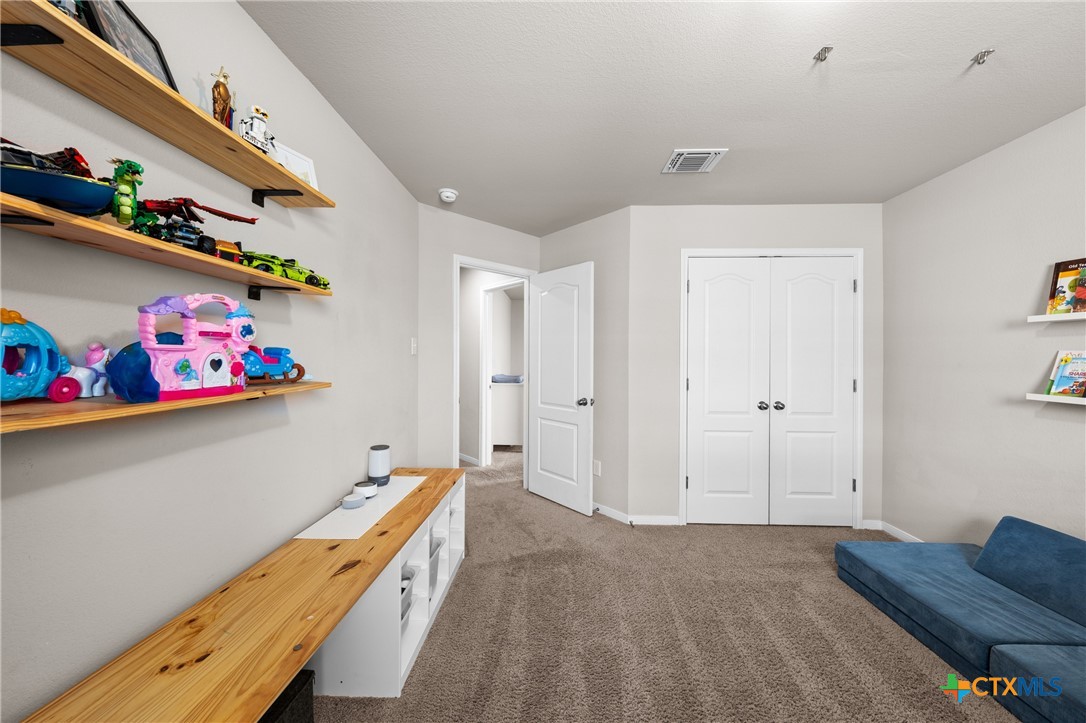 7468 Mossy Ridge Lane Temple, TX 76502 - Photo 24 of 38 a room with toys and book shelf