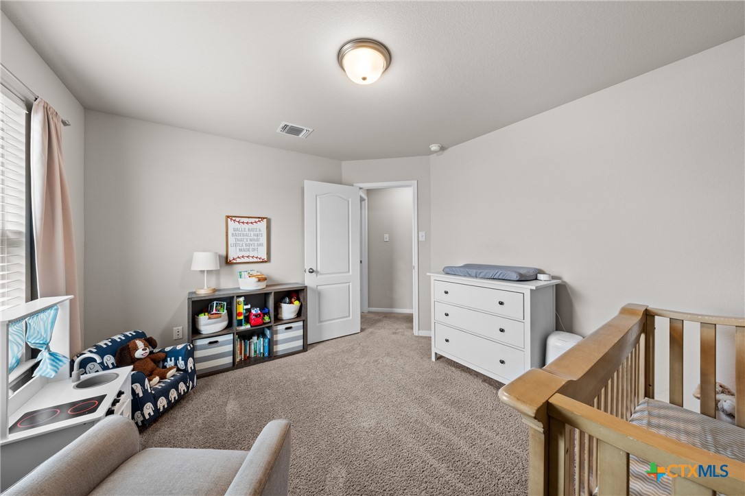 7468 Mossy Ridge Lane Temple, TX 76502 - Photo 26 of 38 a view of a livingroom with furniture and a flat screen tv