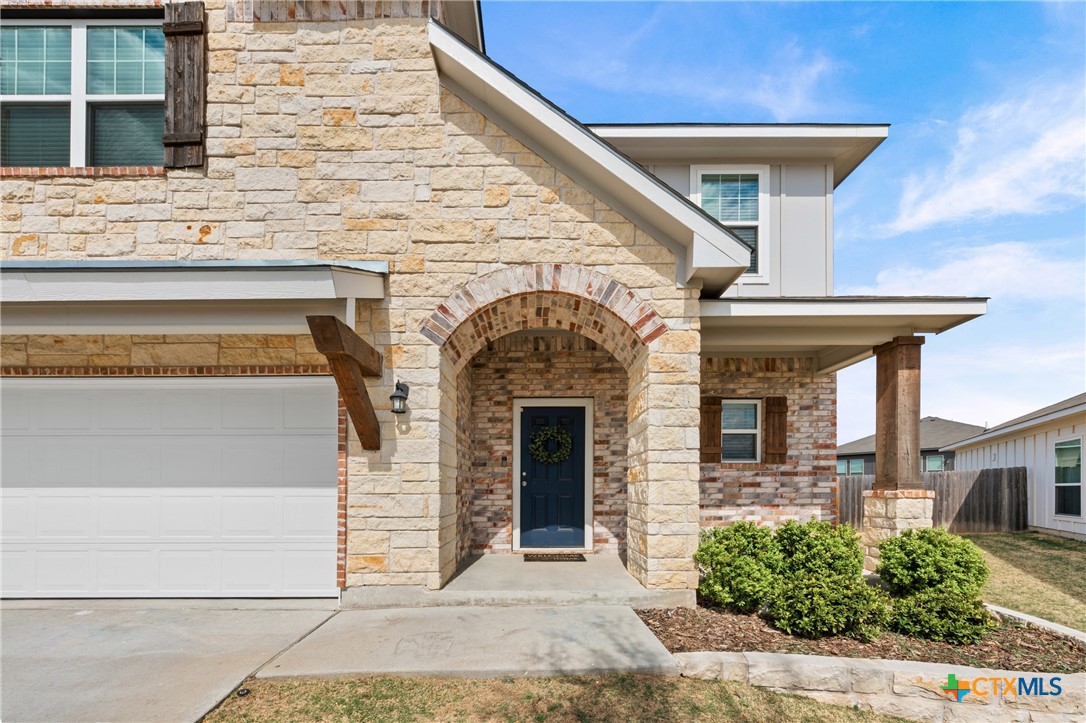 7468 Mossy Ridge Lane Temple, TX 76502 - Photo 3 of 38 a front view of a house with garage