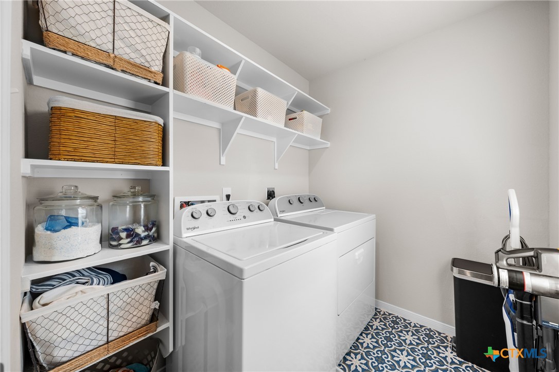 7468 Mossy Ridge Lane Temple, TX 76502 - Photo 31 of 38 a utility room with dryer and washer