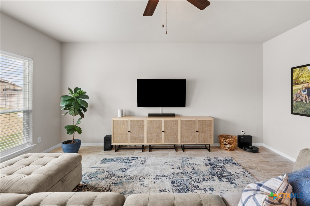 7468 Mossy Ridge Lane Temple, TX 76502 - Photo 5 of 38 a living room with furniture and a flat screen tv
