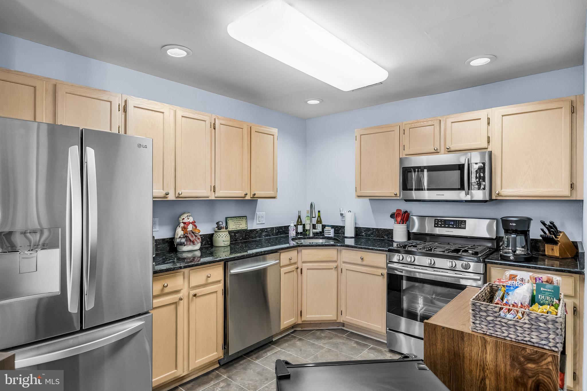 203 Quail Road Marlton, NJ 08053 - Photo 10 of 27 a kitchen with a sink a stove a microwave and refrigerator