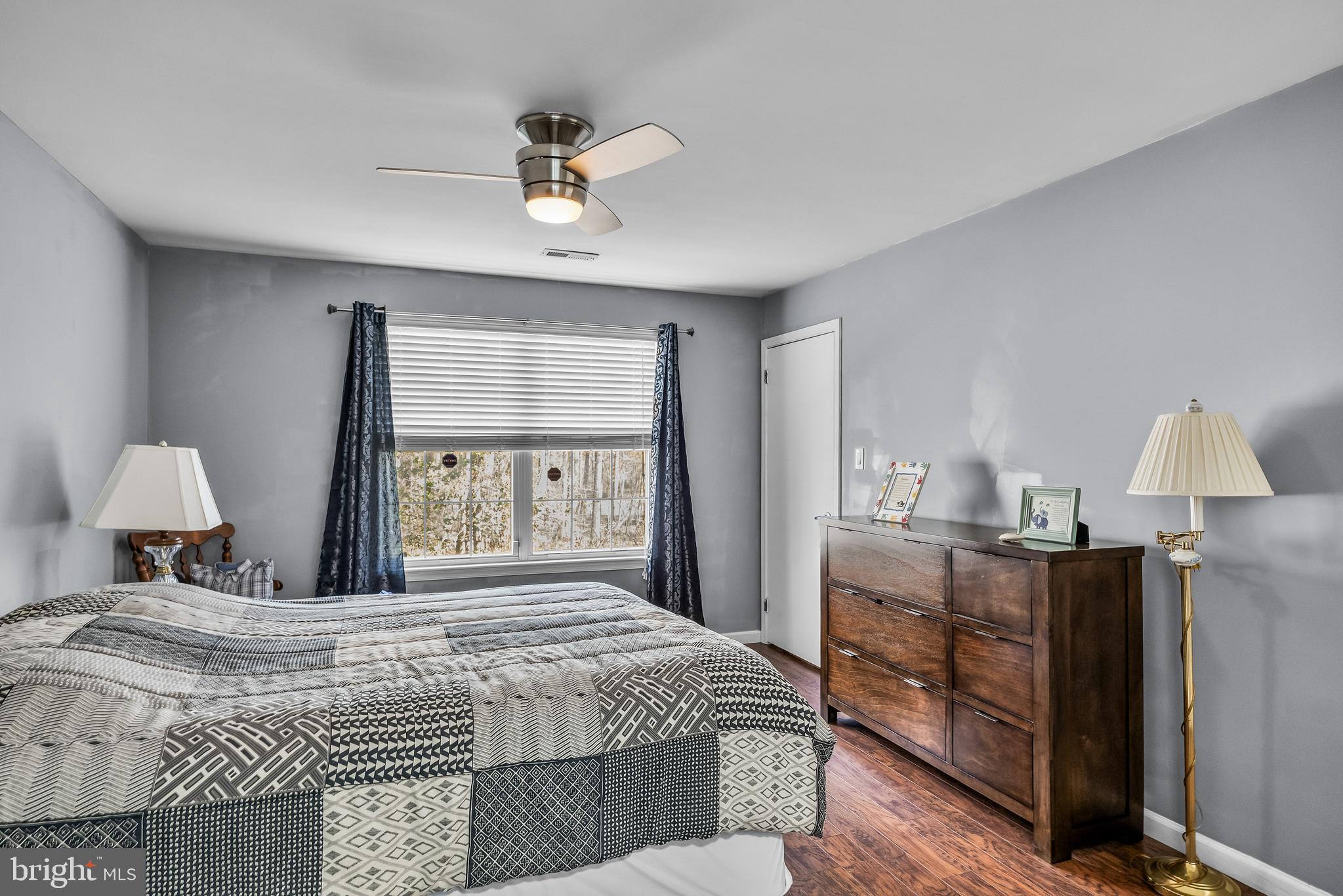 203 Quail Road Marlton, NJ 08053 - Photo 14 of 27 a bedroom with a bed and a chandelier