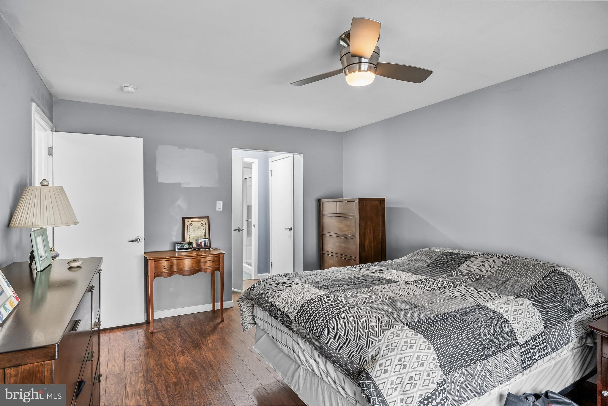 203 Quail Road Marlton, NJ 08053 - Photo 15 of 27 a bedroom with a bed and a chandelier