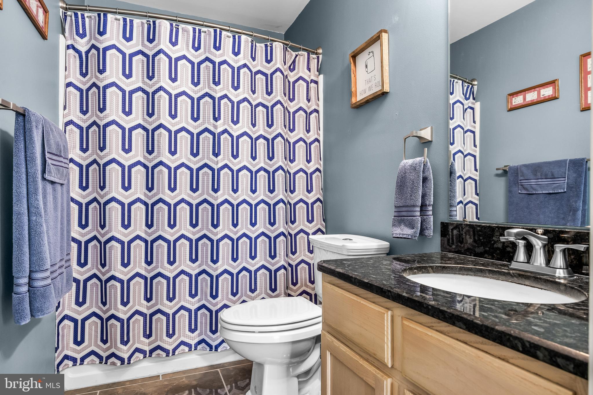 203 Quail Road Marlton, NJ 08053 - Photo 18 of 27 a bathroom with a granite countertop sink and a toilet