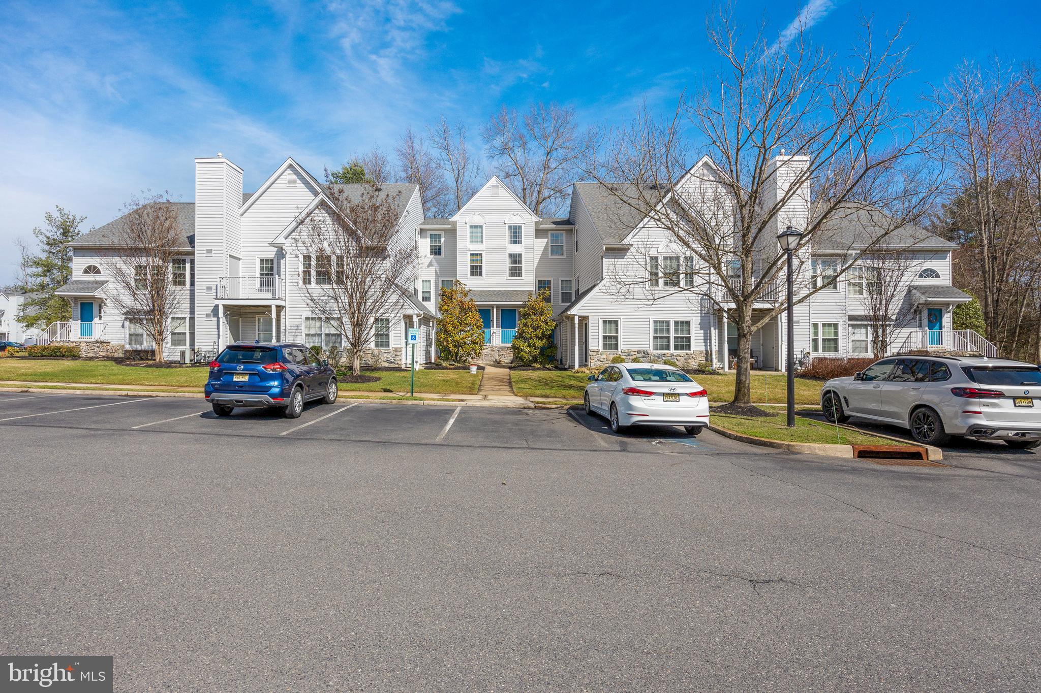 203 Quail Road Marlton, NJ 08053 - Photo 23 of 27 a car parked on the side of a street
