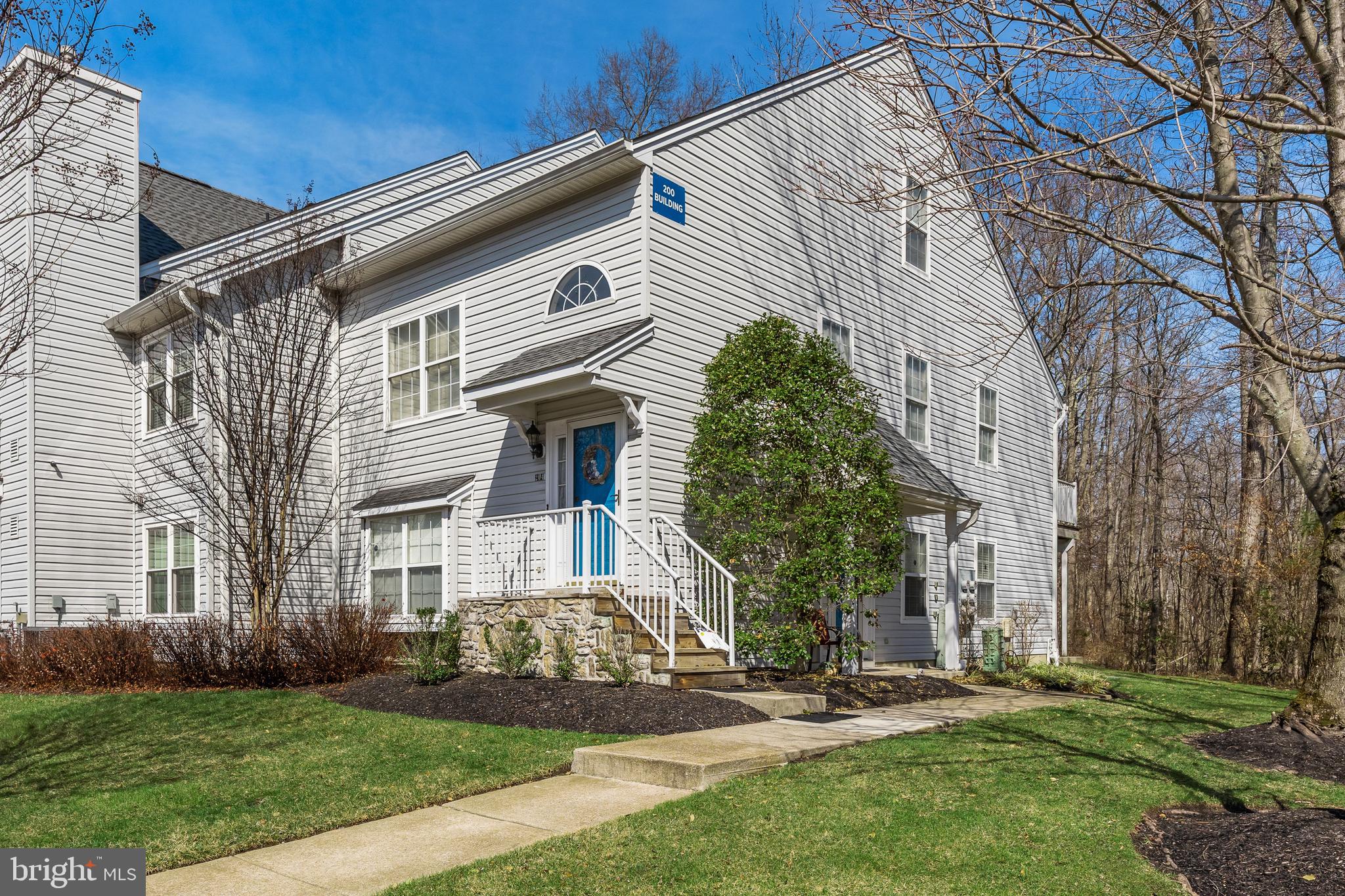 203 Quail Road Marlton, NJ 08053 - Photo 24 of 27 a view of a white house with a yard and plants