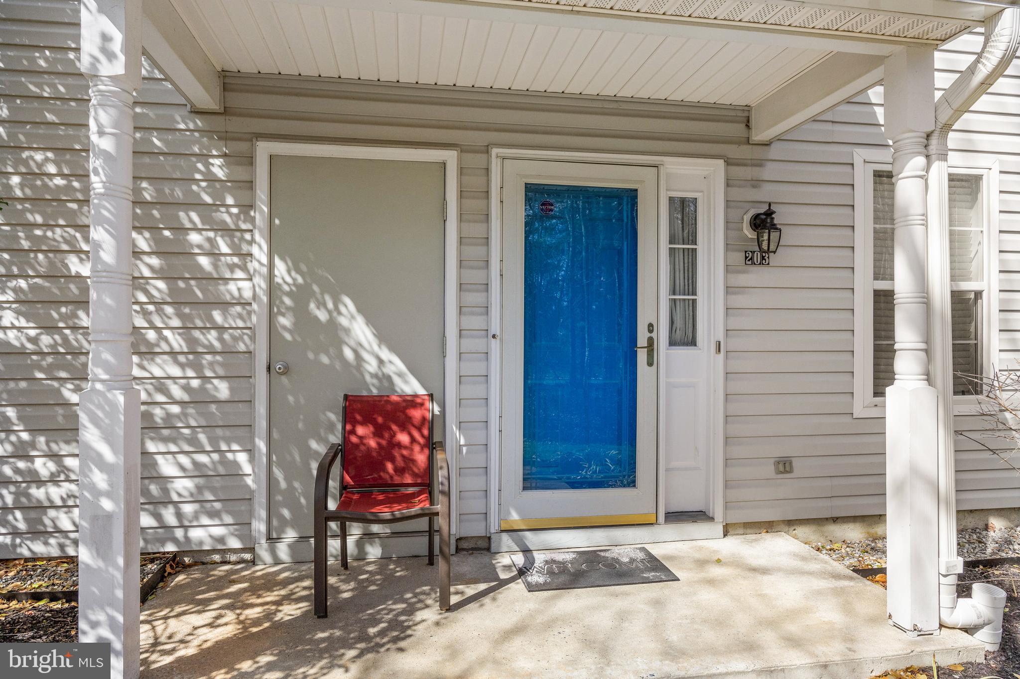 203 Quail Road Marlton, NJ 08053 - Photo 4 of 27 a backyard of a house with potted plants