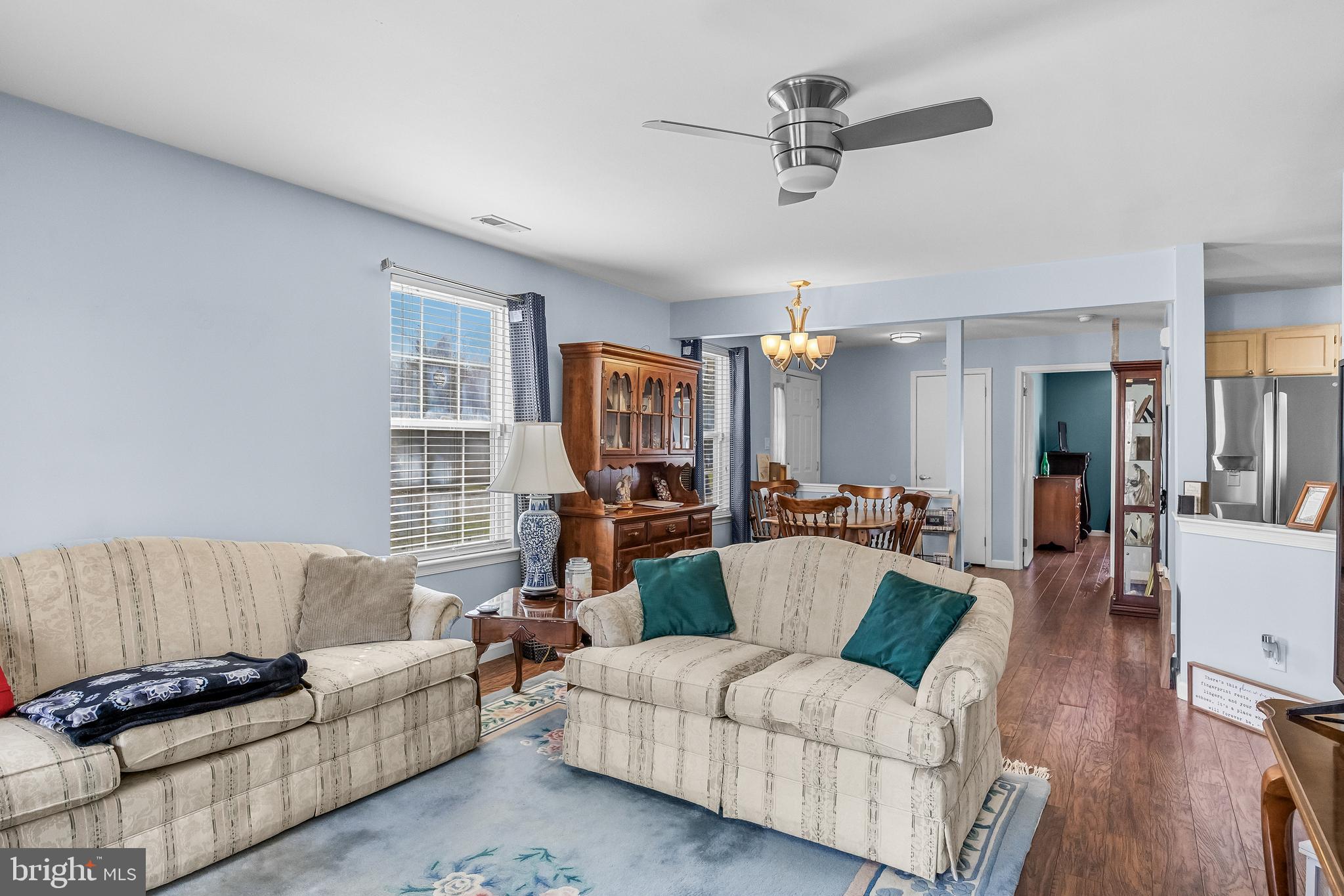 203 Quail Road Marlton, NJ 08053 - Photo 7 of 27 a living room with furniture ceiling fan and a window