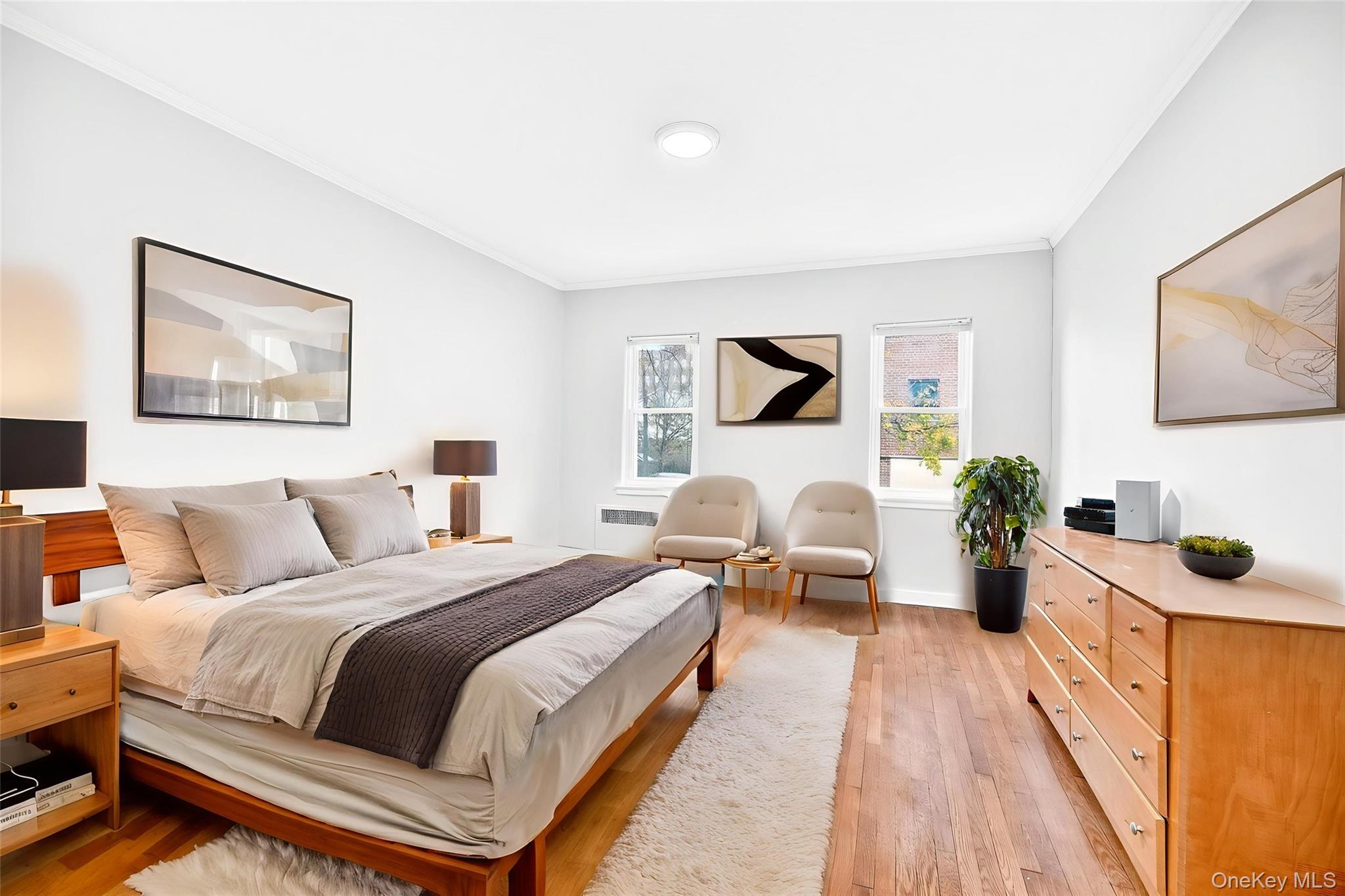 1458 Rowland Street Bronx, NY 10461 - Photo 4 of 49 Bedroom with ornamental molding, light wood-style flooring, and radiator