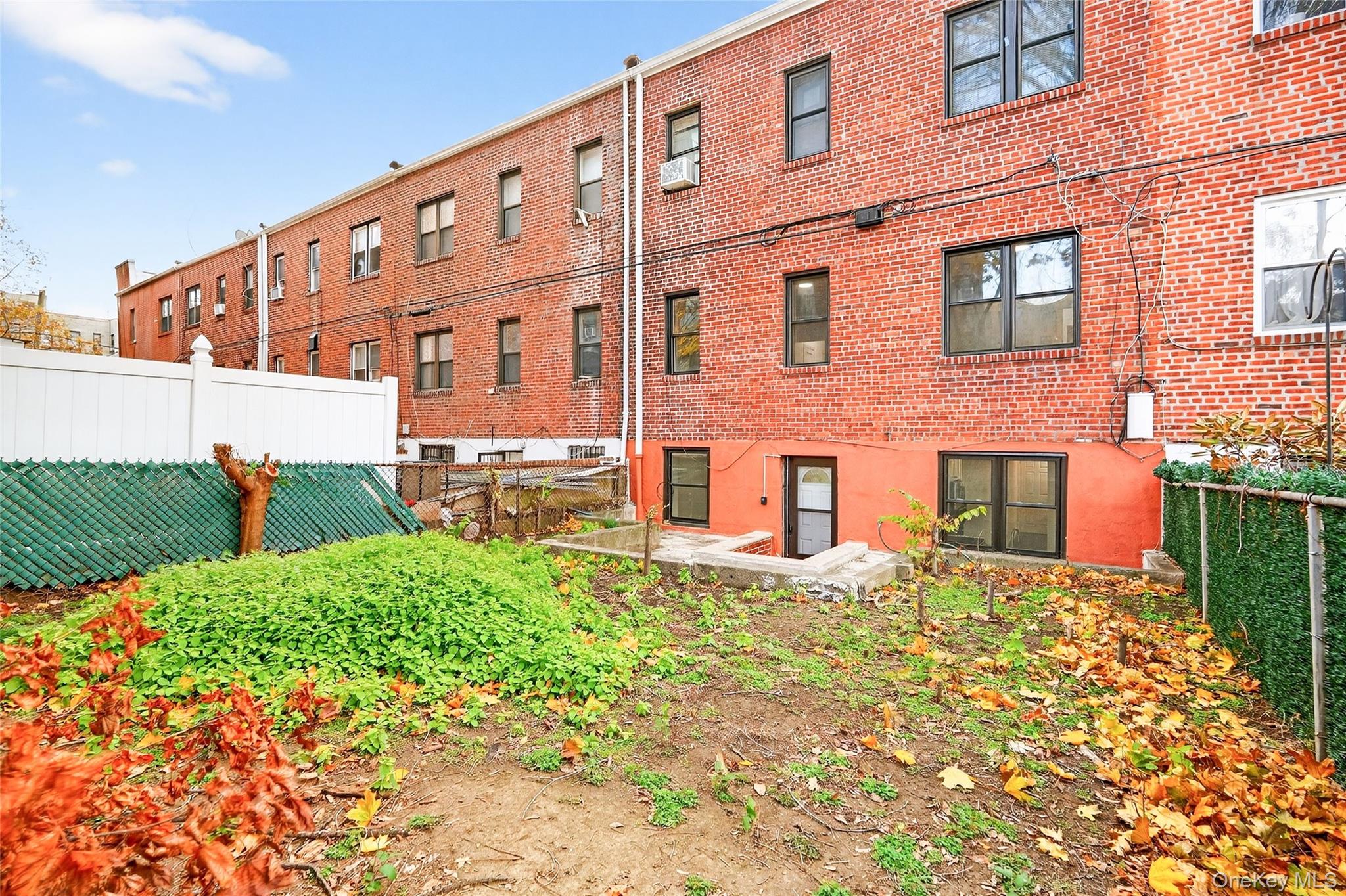 1458 Rowland Street Bronx, NY 10461 - Photo 47 of 49 Back of property featuring a patio and brick siding