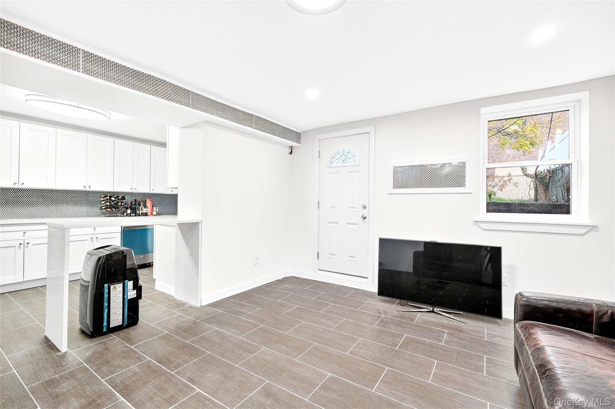 1458 Rowland Street Bronx, NY 10461 - Photo 6 of 49 Living room with baseboards and recessed lighting
