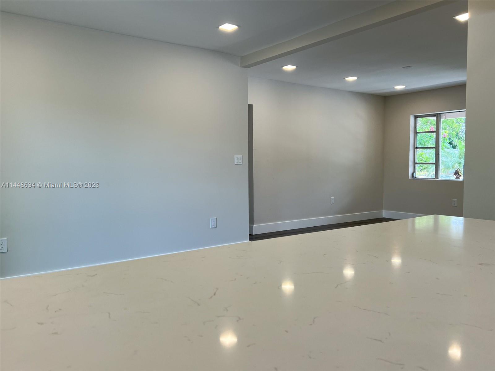 Pinewood Miami, FL 33167 - Photo 12 of 31 an empty room with windows