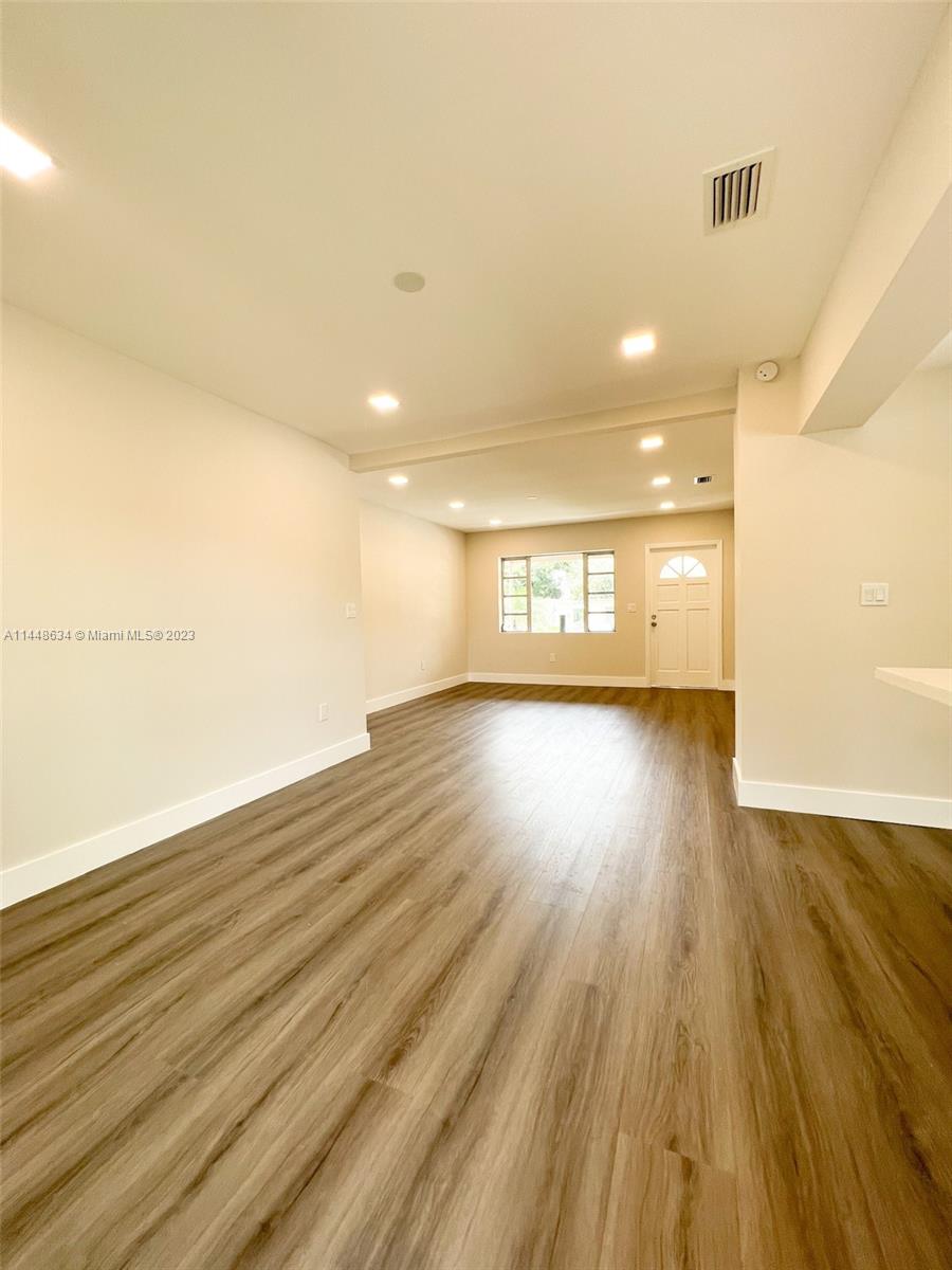 Pinewood Miami, FL 33167 - Photo 24 of 31 a view of an empty room and wooden floor