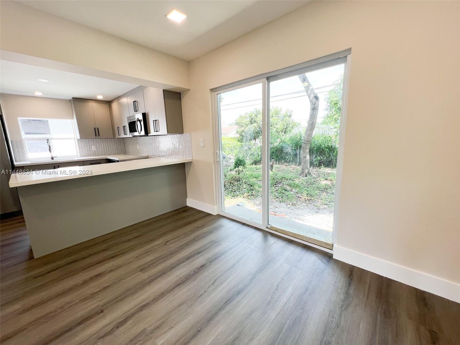 Pinewood Miami, FL 33167 - Photo 25 of 31 a view of kitchen with sink and wooden floor
