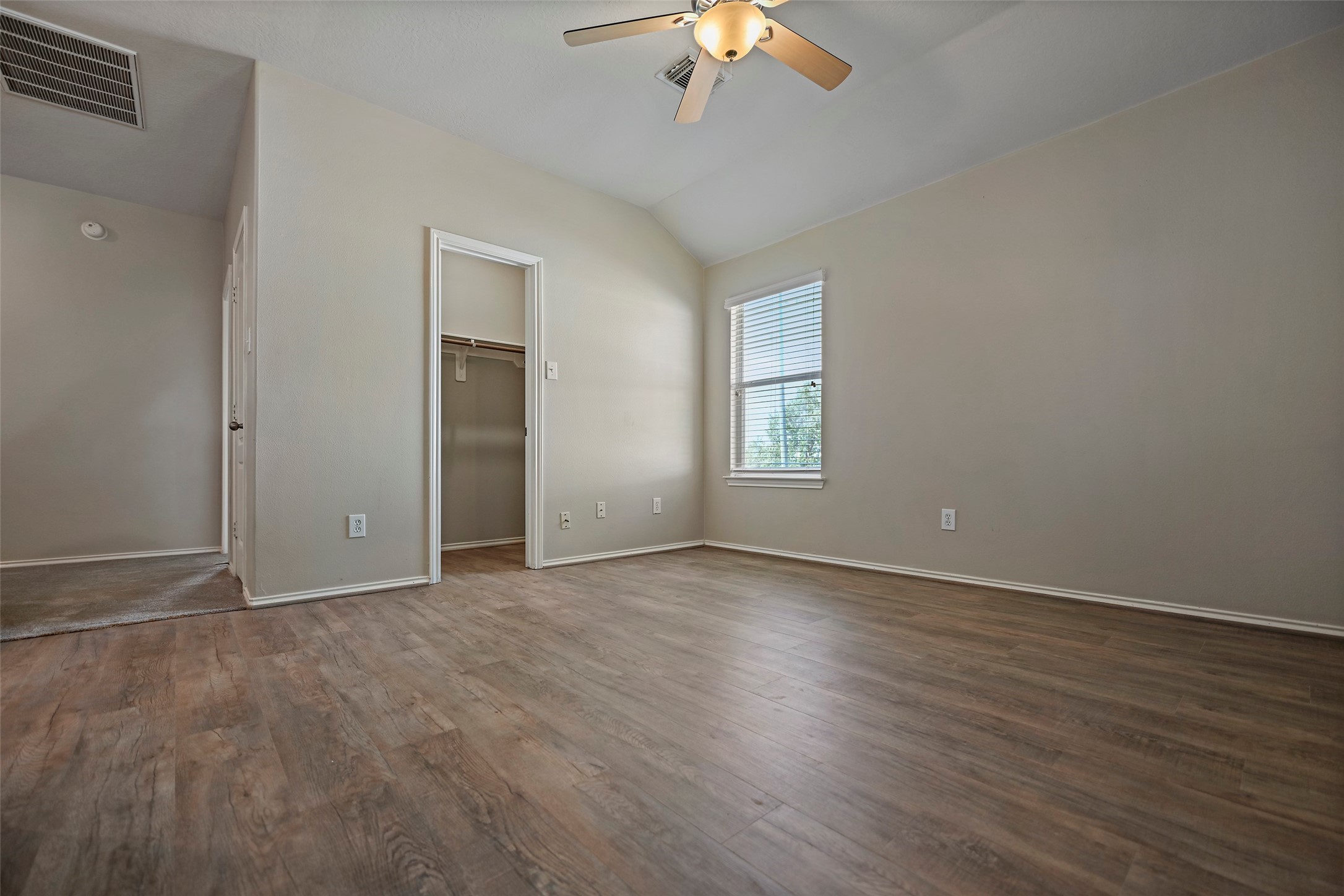 20739 Stewart Crest Lane Cypress, TX 77433 - Photo 16 of 35 a view of an empty room with a window and wooden floor