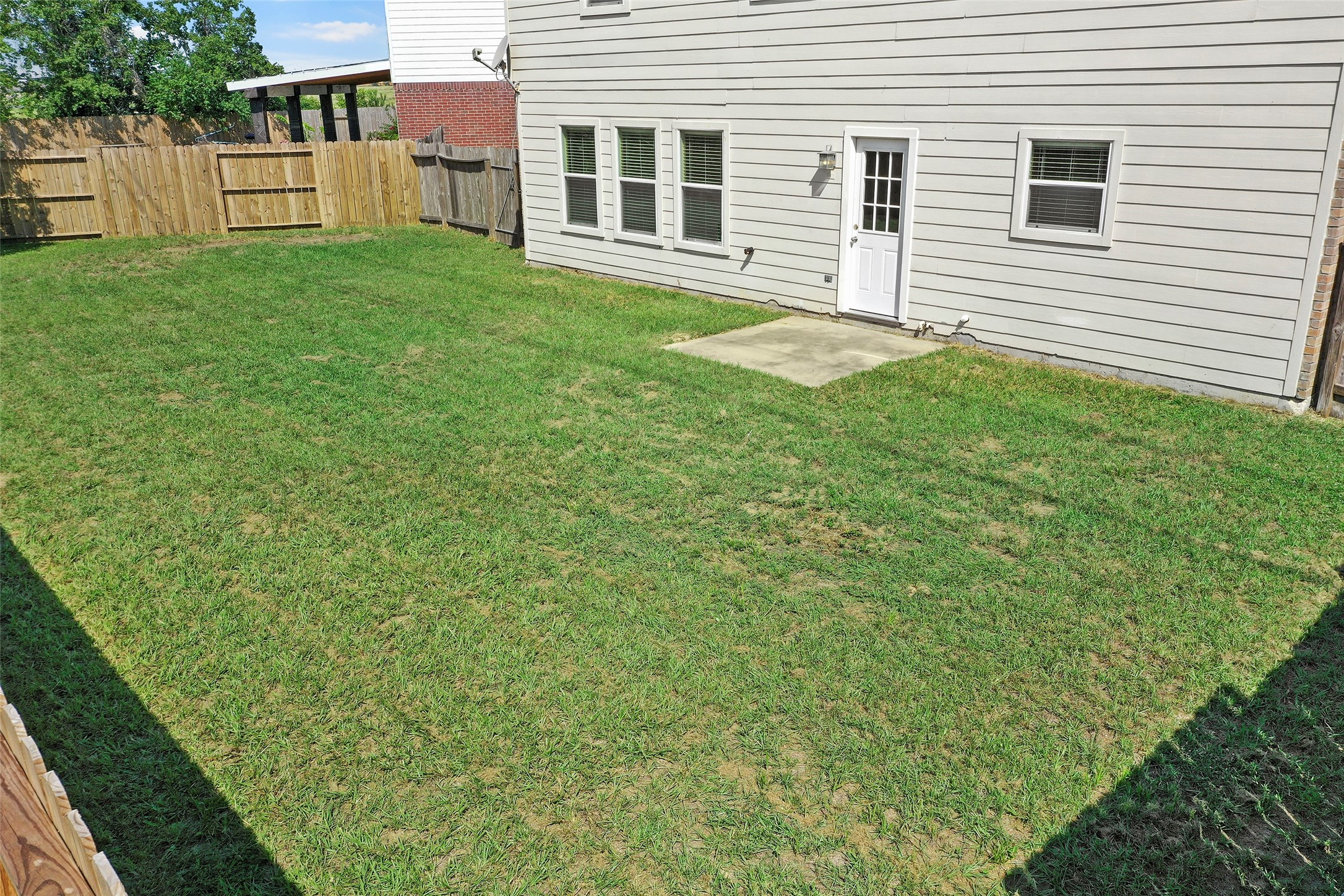20739 Stewart Crest Lane Cypress, TX 77433 - Photo 34 of 35 a backyard of a house with large trees and barbeque oven