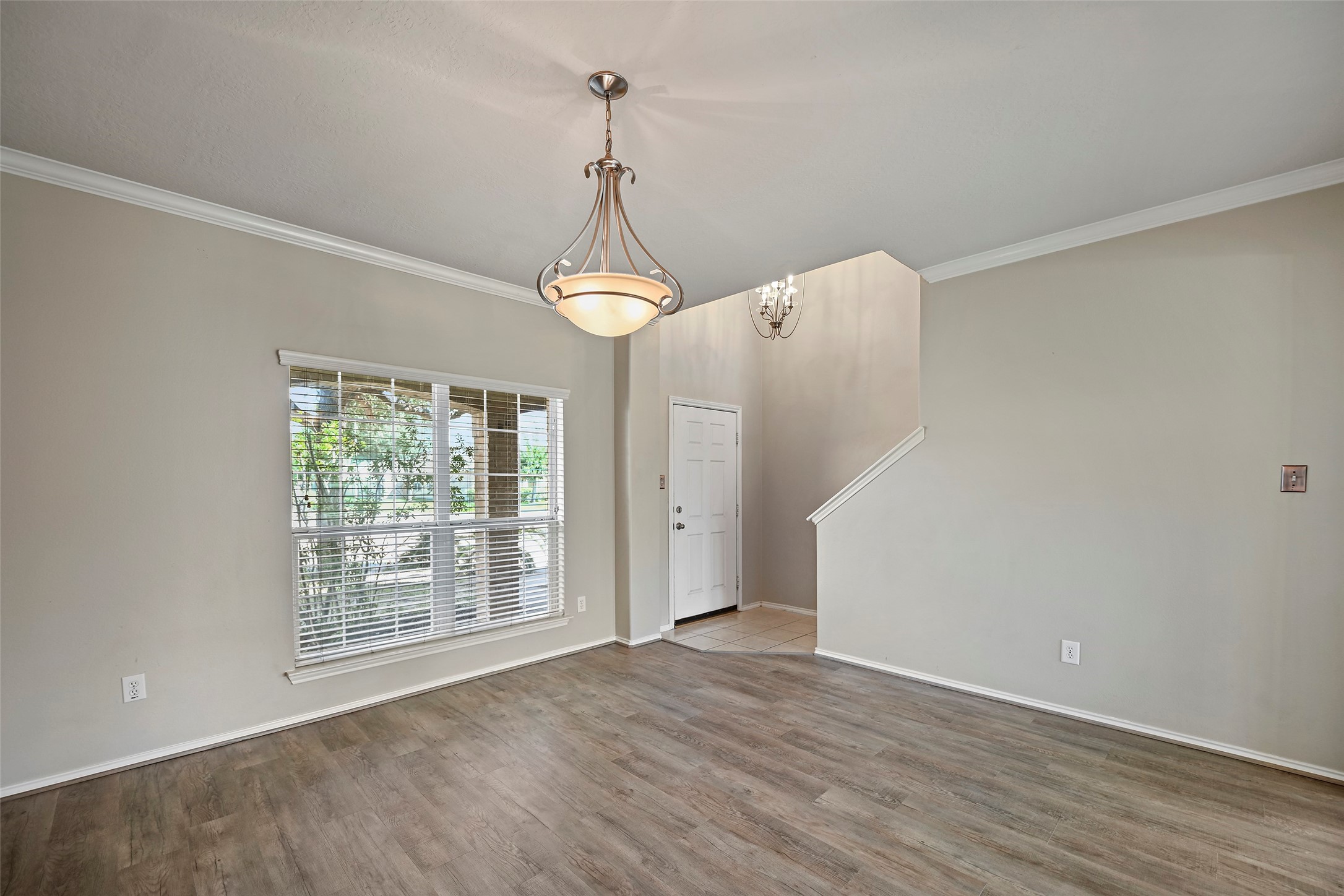 20739 Stewart Crest Lane Cypress, TX 77433 - Photo 4 of 35 a view of a room with wooden floor and windows